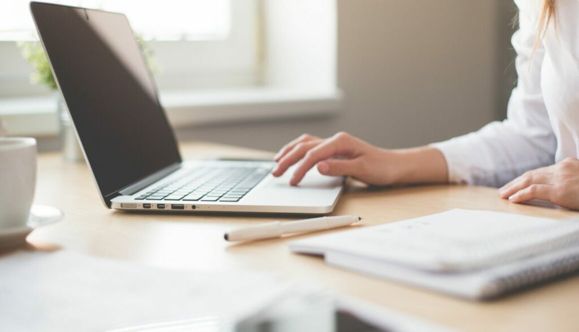 Woman typing on laptop