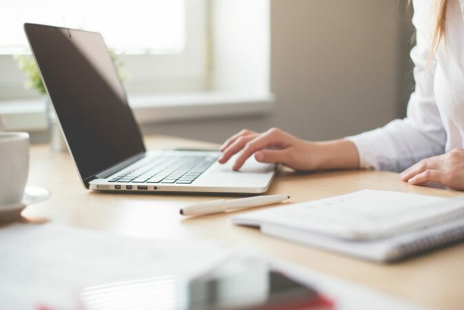 Woman typing on laptop